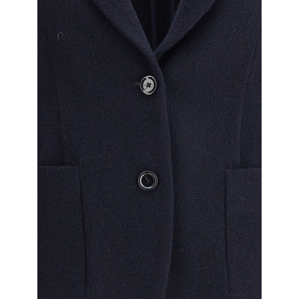 Close-up of Lardini Blue Wool Blazer with button closure and patch pockets, featuring the brand's signature flower-shaped pin.