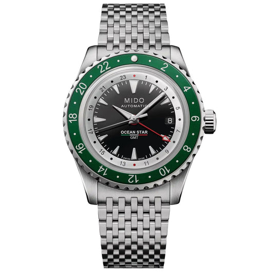 MIDO MOD. OCEAN STAR GMT LIMITED EDITION watch with green bezel and stainless steel bracelet, displayed on a white background.