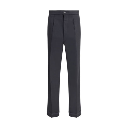 Margiela Black Wool Dress Pants with pleated design and logo closure, featuring elegant turn-ups and welt pockets for functional style.