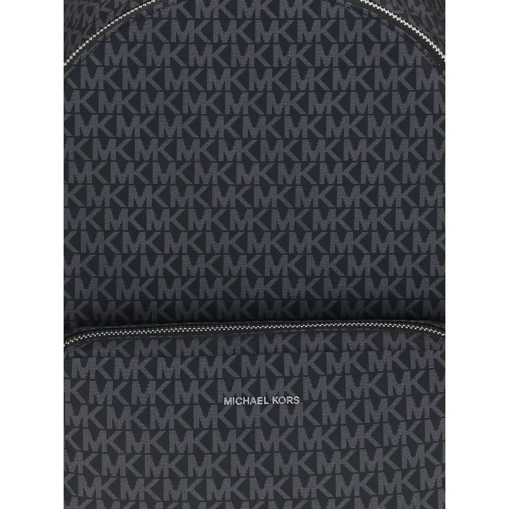 Close-up of a Michael Kors Black Polyester Backpack with logo print and zippered front, crafted for style and practicality in AW25 collection.