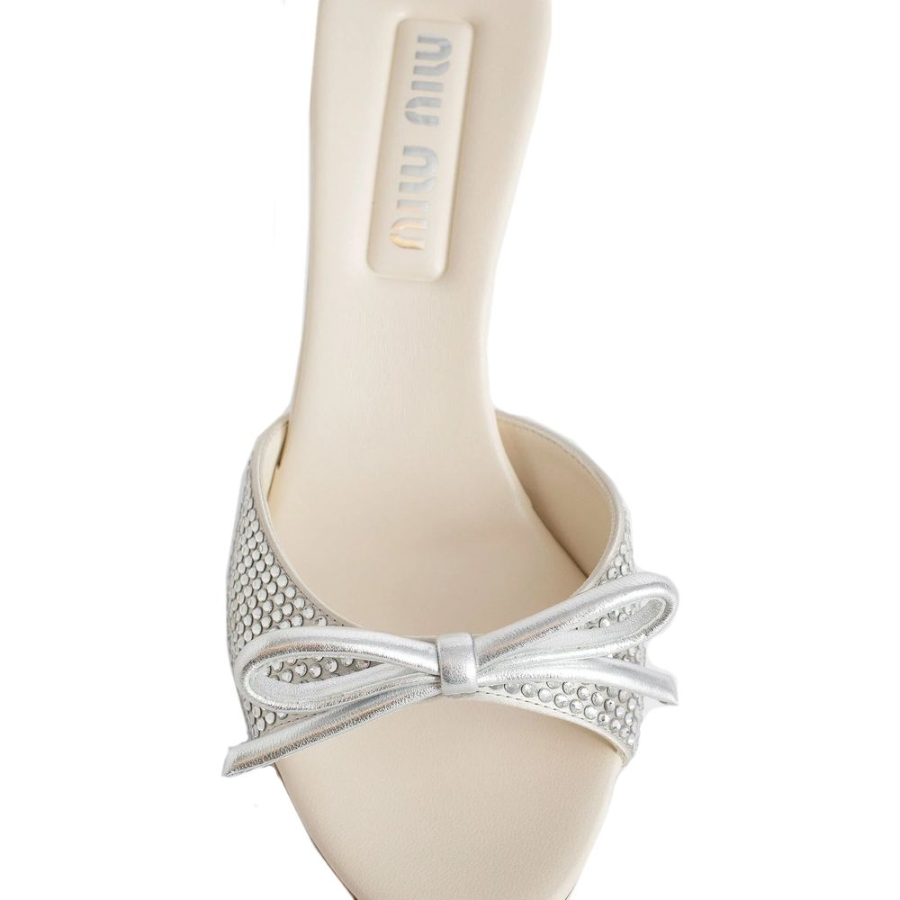 Miu Miu Silver Silk Mules with crystal embellishments and bow detail, featuring leather insole and open design