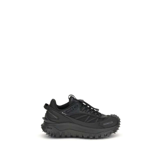 Moncler Black Calf Leather Bos Taurus Athletic Sneakers with reflective inserts and embossed logos, featuring drawstring closure and padded design.