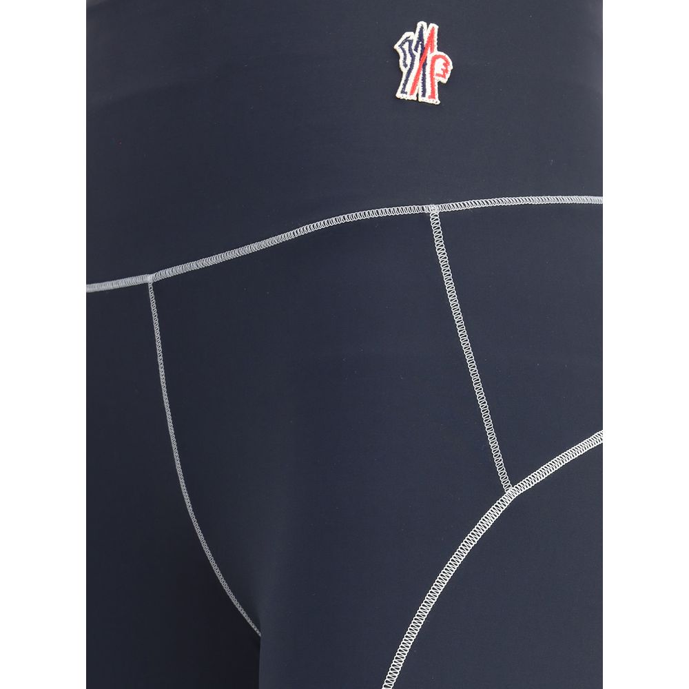 Close-up of Moncler Grenoble Leggings showing technical fabric and logo patch, designed for active lifestyle, gym, and trail use.