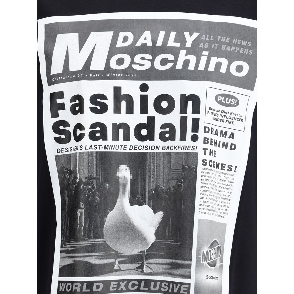 Moschino Black Cotton T-Shirt with newspaper print featuring 'Fashion Scandal!' and duck image, showcasing bold, unique style.
