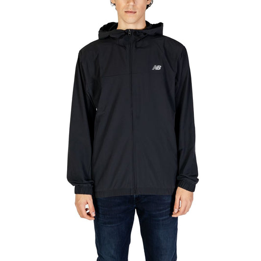 Person wearing New Balance Black Recycled Polyester Shell Jacket with adjustable hood and full front zip closure.