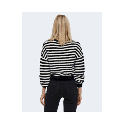 Woman wearing Only Black And White Marabou Sweatshirt, striped design, back view showing long sleeves, suitable for casual occasions.