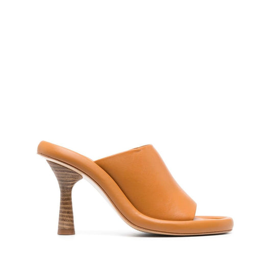Paloma Barceló Paloma Barcelò Sandals Yellow, 110mm ochre yellow leather open-toe slip-on sandals with sculpted heel.