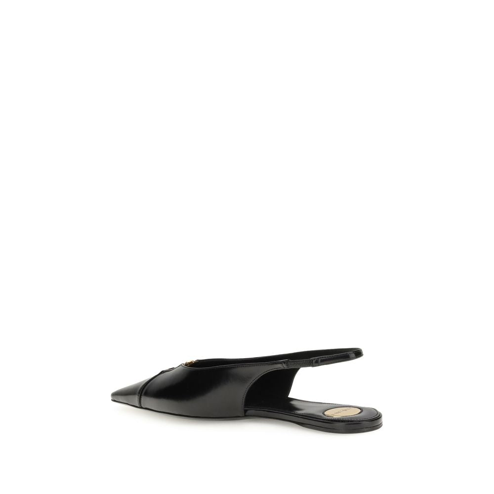 Saint Laurent Black Calf Leather Bos Taurus Ballet Flats featuring cut-out toe and bronze CASSANDRE detail, side view.