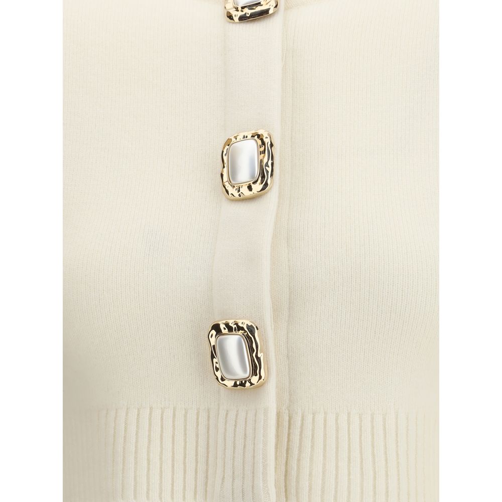 Close-up of Self-Portrait Cream Wool Cardigan with decorative buttons and ribbed edges, showcasing elegant design details.
