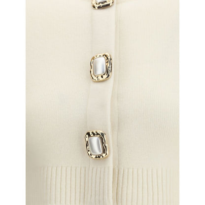Close-up of Self-Portrait Cream Wool Cardigan with decorative buttons and ribbed edges, showcasing elegant design details.