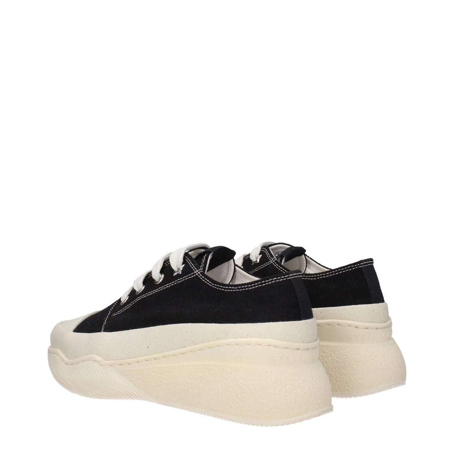 Stella McCartney Black Fabric Chunky Sneakers with white rubber sole and lace-up closure, side view showcasing mid heels and round toe.