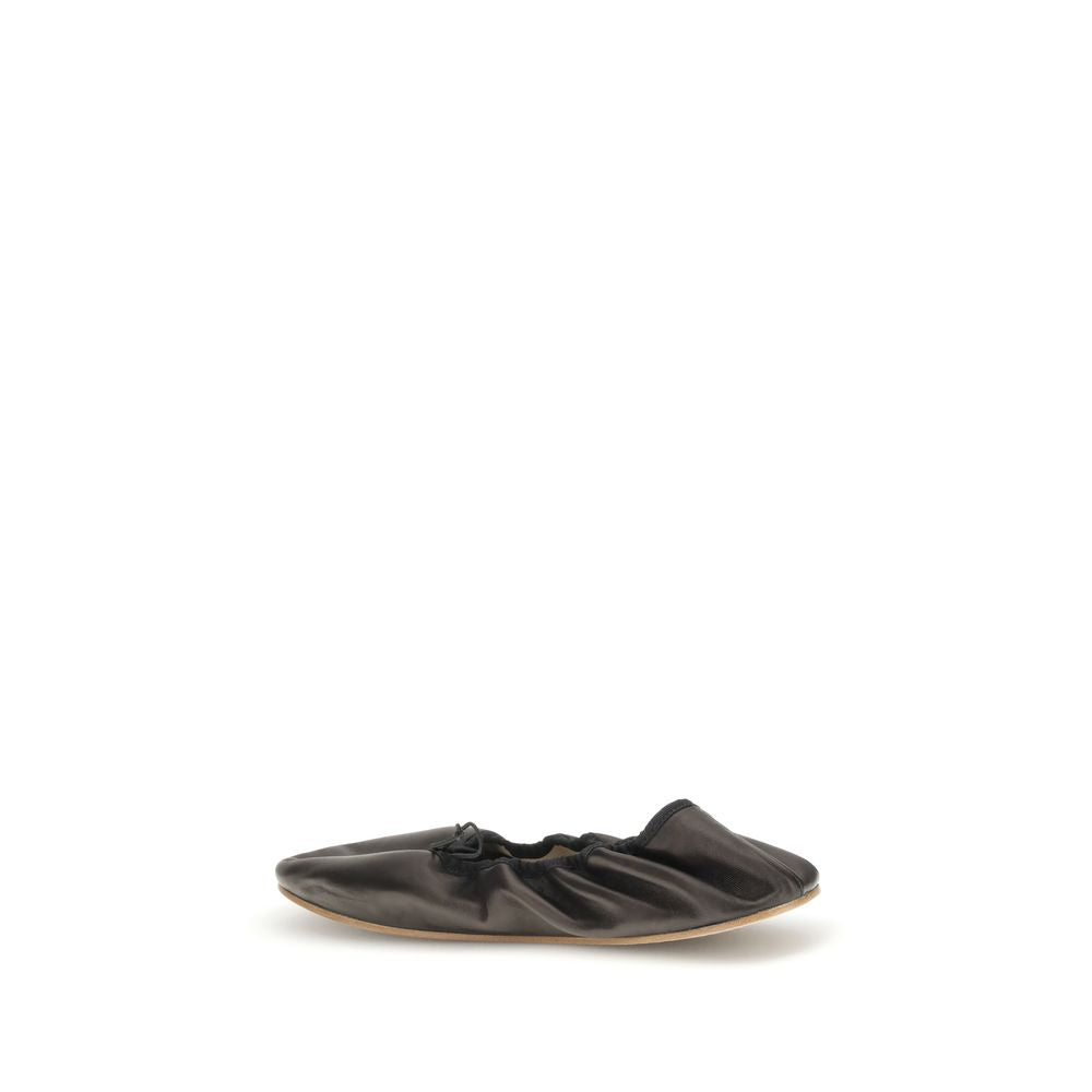 The Row Black Lamb Ovis Aries Aries Ballet Flats in soft nappa leather with grosgrain trim and adjustable elastic lace.