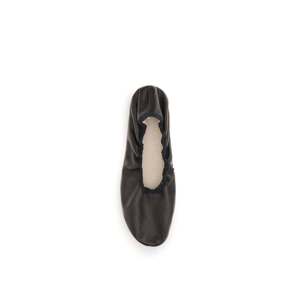 The Row Black Lamb Ovis Aries Aries Ballet Flats in nappa leather with grosgrain trim and elastic lace.