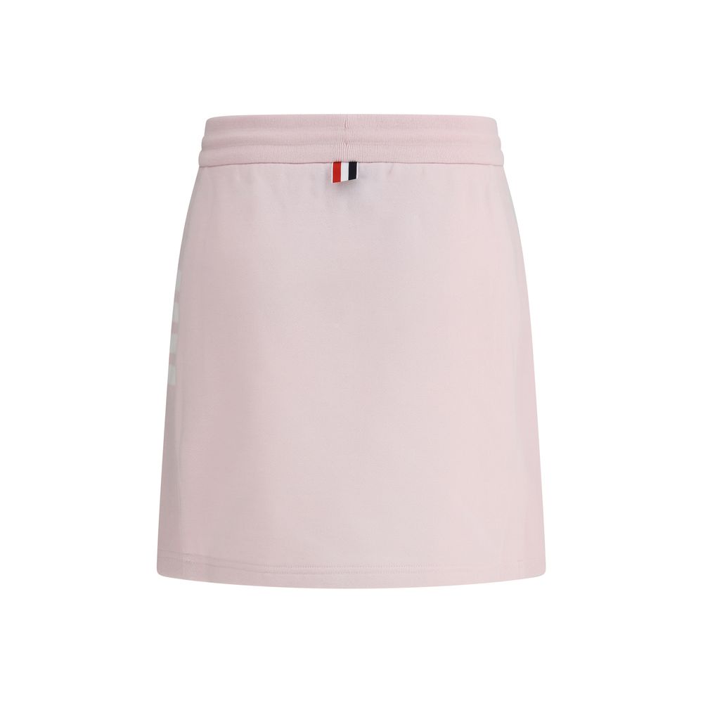 Thom Browne Multicolor Cotton Mini Skirt with drawstring waistband, front slits, logo patch, and iconic multicolored bands.