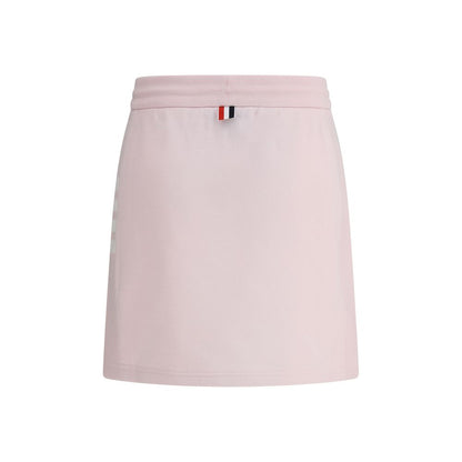 Thom Browne Multicolor Cotton Mini Skirt with drawstring waistband, front slits, logo patch, and iconic multicolored bands.