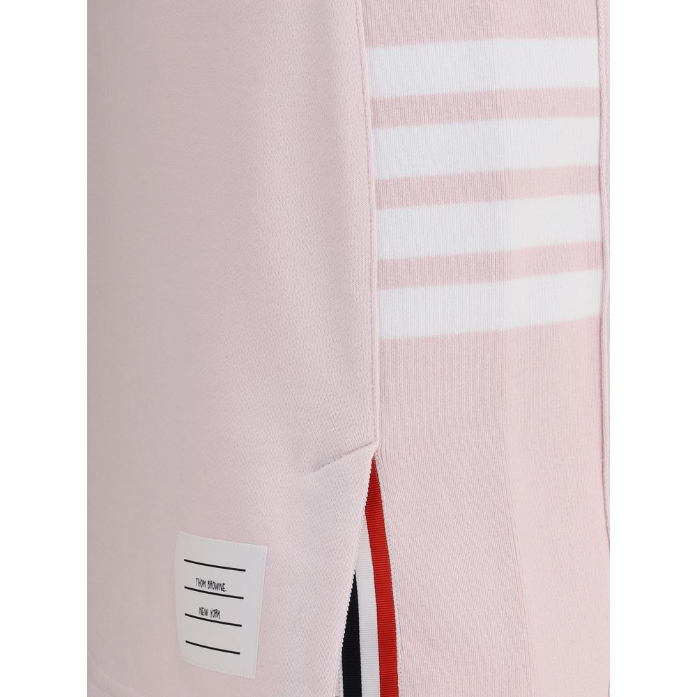Close-up of Thom Browne Multicolor Cotton Mini Skirt with logo patch and signature side bands, featuring front slit detail.