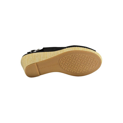Sole view of Tommy Hilfiger Black Cotton Women Sandal with distinctive embossed pattern and logo, showcasing durable wedge design.