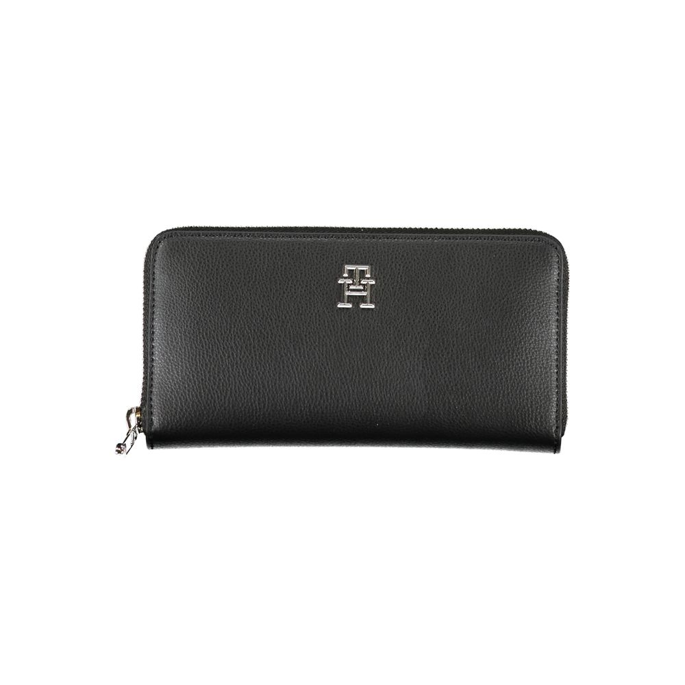 Tommy Hilfiger Black Polyester Wallet featuring zip closure, logo, 5 compartments, card slots, coin purse, made from recycled polyester.