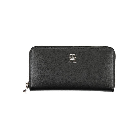 Tommy Hilfiger Black Polyester Wallet featuring zip closure, logo, 5 compartments, card slots, coin purse, made from recycled polyester.