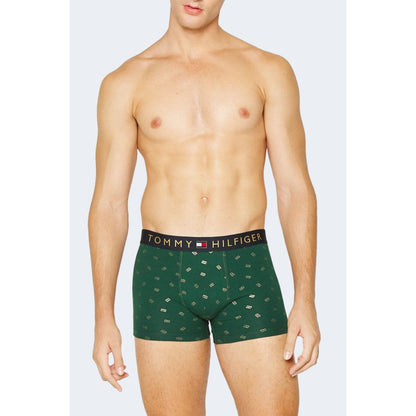 Model wearing Tommy Hilfiger Green Cotton Boxers with elegant graphic pattern and iconic brand details.