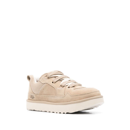 UGG Australia Sneakers Beige with lace-up fastening, pull-tab, and rubber sole. Debossed logo on side. Lowmel style with 0.8 in platform.