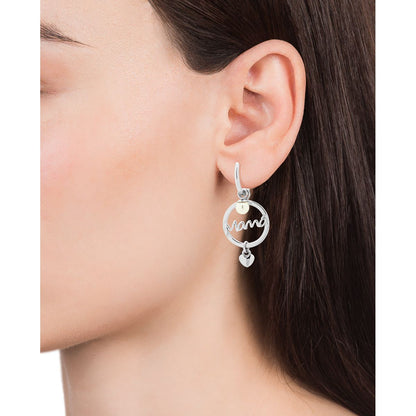 Silver earring with 'mama' script design worn by a woman.
