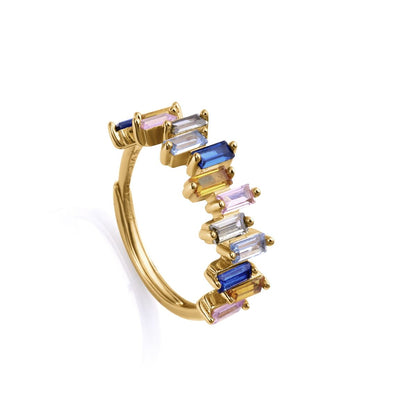 Elegant multicolor gemstone ring with gold band, featuring unique rectangular stones in blue, pink, and clear.