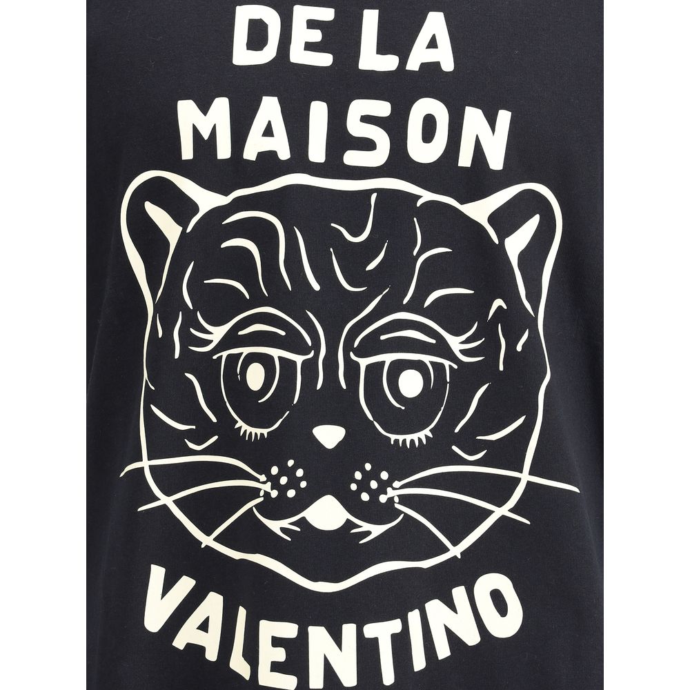 Valentino Black Cotton T-Shirt featuring Le Chat De La Maison graphic print, showcasing casual elegance with ribbed crew neck design.