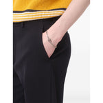Valentino Garavani Ovalette Bracelet with silver-tone VLogo Signature curb chain on model's wrist.