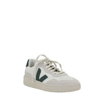 Veja V-90 Sneakers in white with green V logo, organic leather, minimalist design, and lace-up closure.