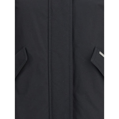 Close-up of Woolrich Black Cotton Shell Jacket front with zipper and pockets, showcasing quality design details and materials.